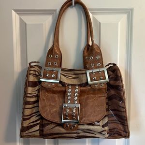 Purse in great condition, brown tiger stripe with silver accents.